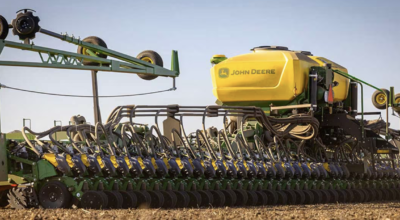 John Deere planter sweeping across a field